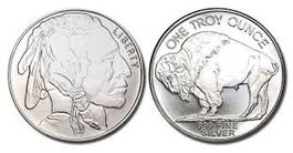 A silver coin with an indian head on it.