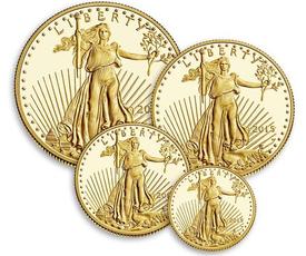 A group of four gold coins with the image of an eagle on them.