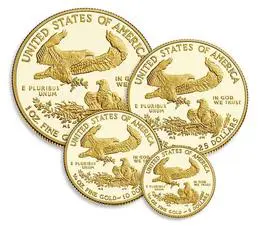 A group of four gold coins with the image of an eagle on them.